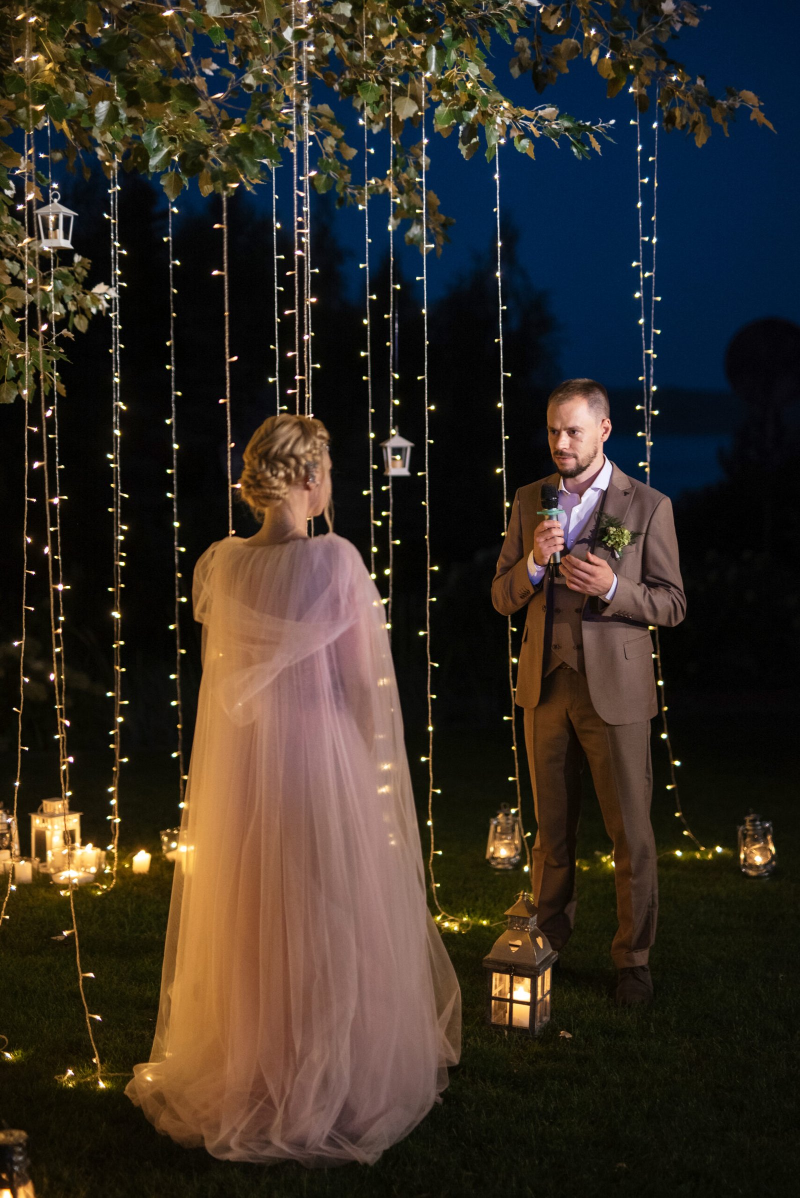 night wedding ceremony of the newlyweds in a country cottage